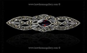 Silver Marcasite Brooch Set With A Garnet Stone